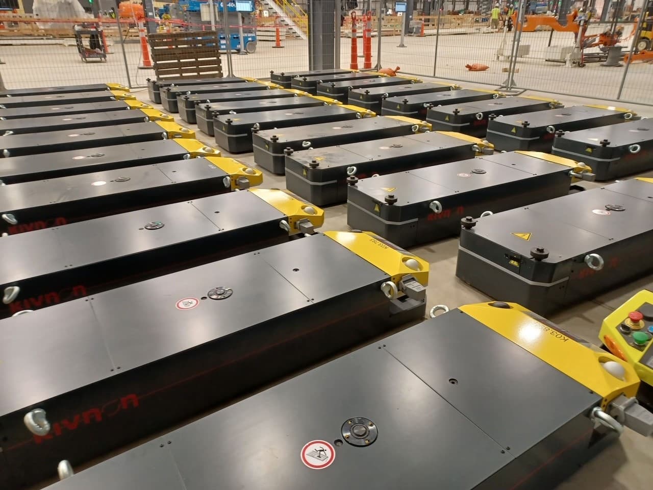 Fleet of Kivnon AGVs staged for a large-scale installation — AGV America